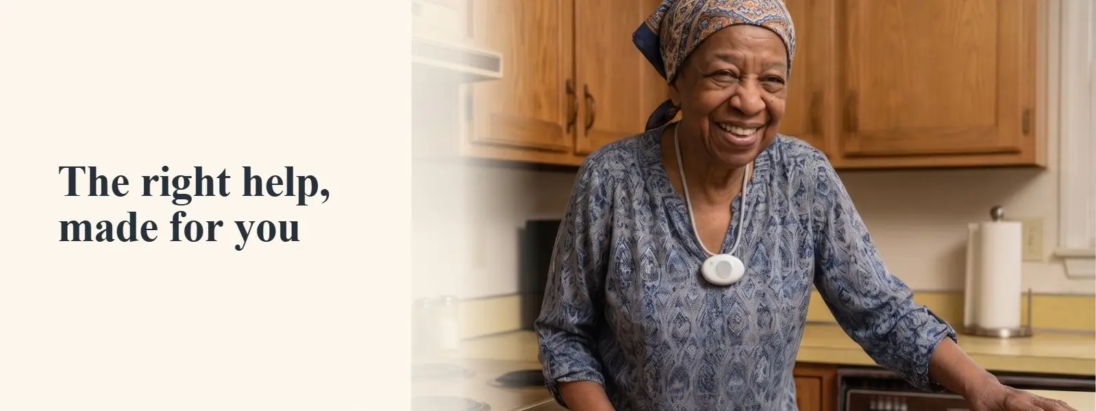 Smiling senior woman wearing a Bedford Medical Alert help button in her kitchen